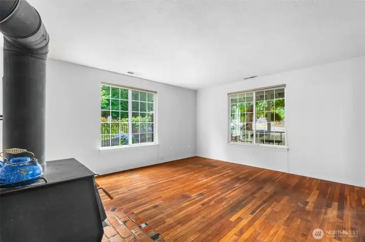 The original wood floors in the living room are in great shape and show their historical character.
