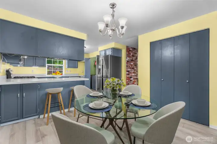 The dining area features a large pantry! This photo is virtually staged.