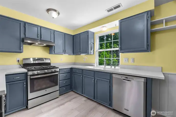 The gas stove top highlights this upgraded kitchen.