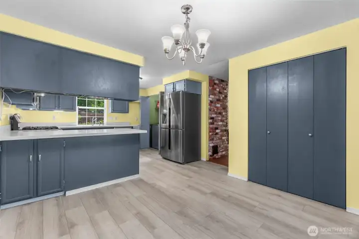 Double door pantry adjacent to the dining space, kitchen and family room.