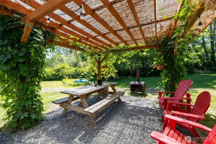 Just off the sitting room is a wonderful pergola with room to gather and enjoy an outdoor meal and fire. Just off the sitting room is a wonderful pergola with room to gather and enjoy an outdoor meal and fire.