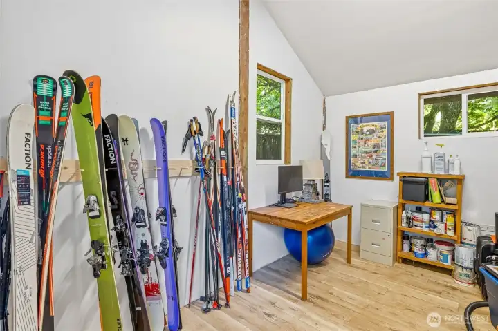 There is a finished room with exterior door on the backside of the shop - perfect for a home office, storage, or possible extra sleeping space. There is a finished room with exterior door on the backside of the shop - perfect for a home office, storage, or possible extra sleeping space.