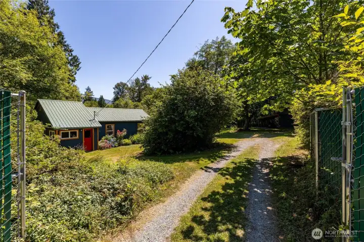 The entire property is fenced, including a gates at the top and bottom of the property. The entire property is fenced, including a gates at the top and bottom of the property.