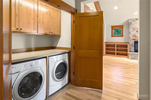 Nice storage and folding area in laundry area.
