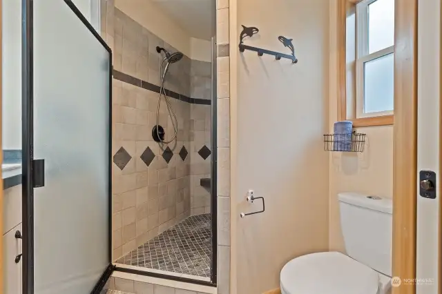 Imagine the relaxing shower with 2 shower heads and beautiful tile work.