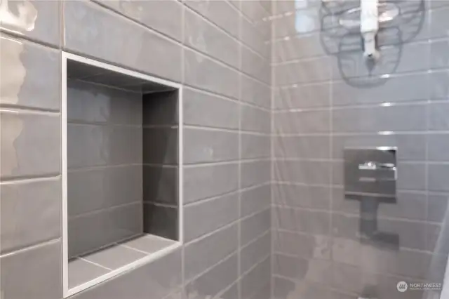 Designer tile shower in 3/4 master bath.