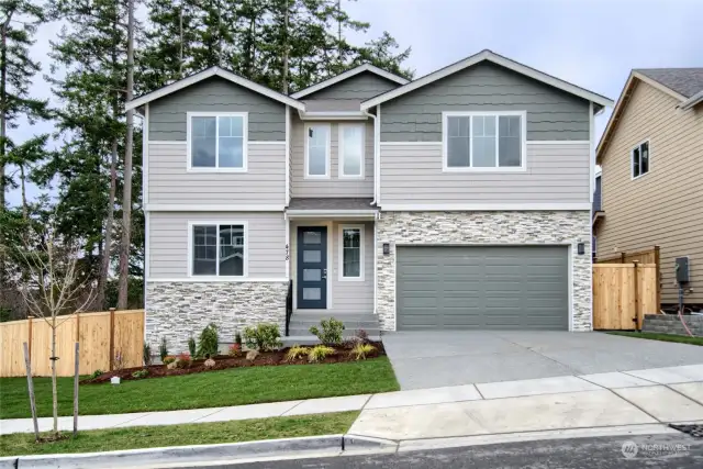 Photo is of a similar home built by this Builder and is for illustration purposes only to reflect layout and typical finishes. May depict seller enhancements. Colors and options may vary.