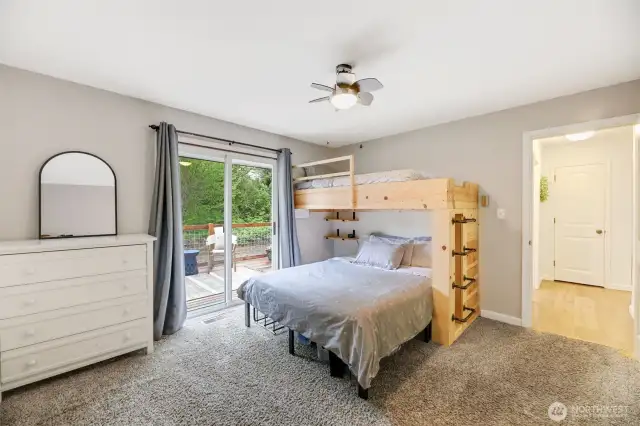 Upstairs bedroom w/ deck.