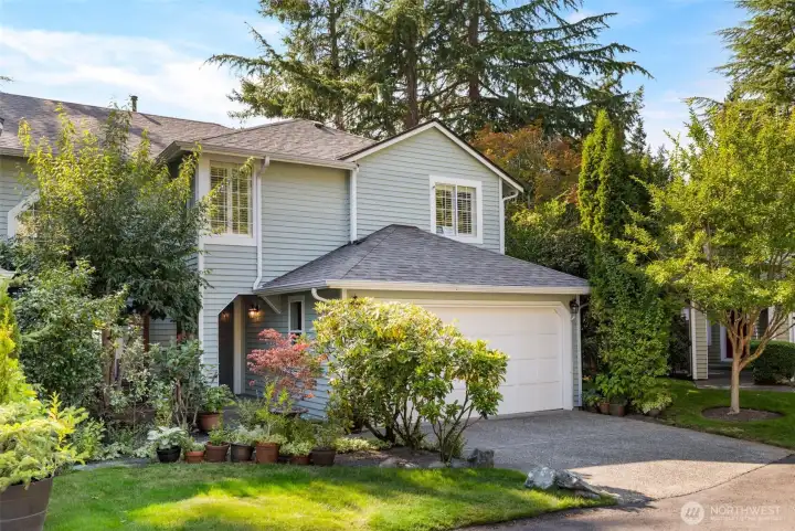 Cul-de-sac location with 2 car garage, 2 car driveway and 5 guest parking spots. Front deck sitting area with front yard and garden space. Right side of house additional garden space.