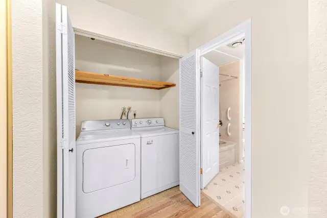 Laundry plus 2 more storage closets