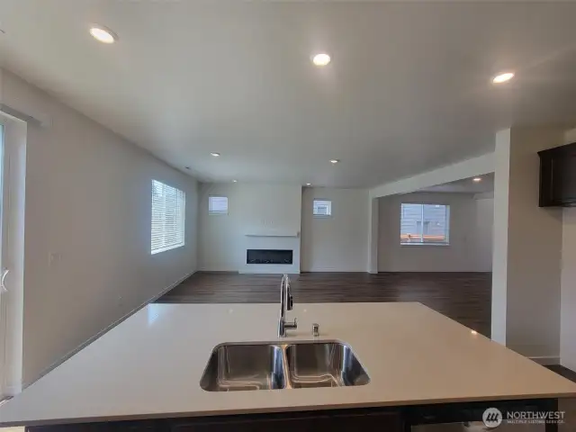 Kitchen overlooking great room and dining space