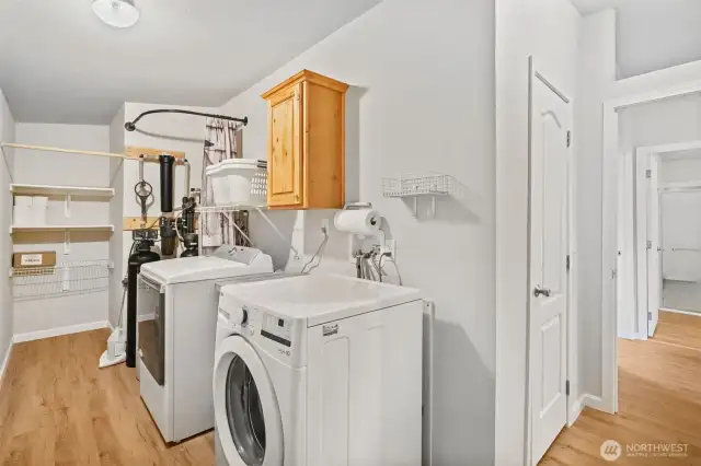 Enjoy the convenience of a utility room equipped with a whole-home water system and included newer washer and dryer.