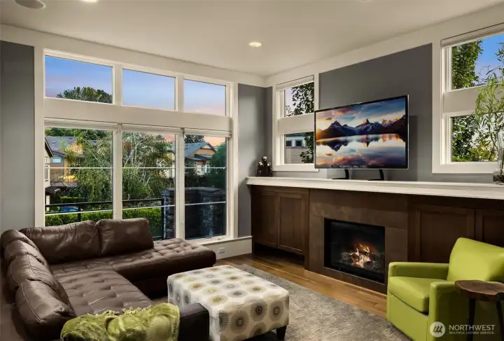 Gas fireplace and floor to ceiling windows