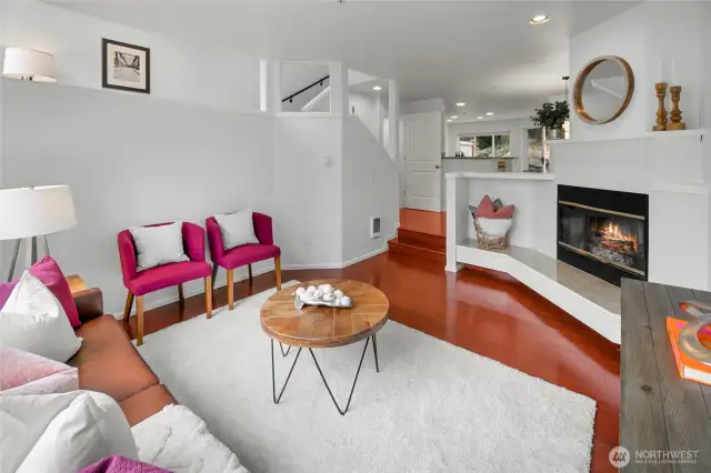 Living room with wood-burning fireplace.
