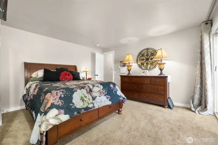 Private primary suite situated at the back of the home