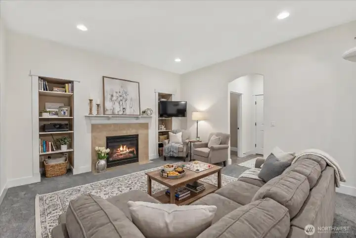 Virtually staged family room. Flatscreen location is wired to mount above fireplace mantle