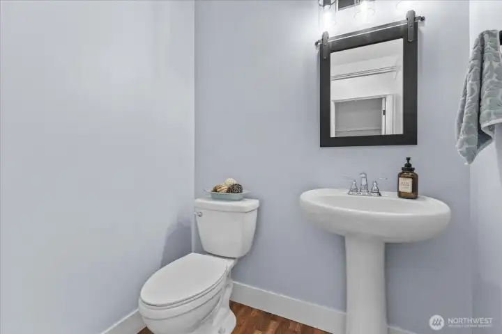 Powder room located off family room in main
