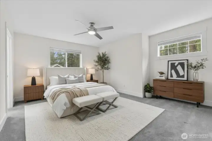 Primary bedroom. Primary bath located on left. Virtually staged. Window coverings convey
