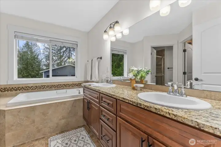 Primary ensuite bathroom with double granite vanity