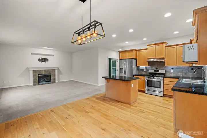 Expansive living room with access to dining and kitchen
