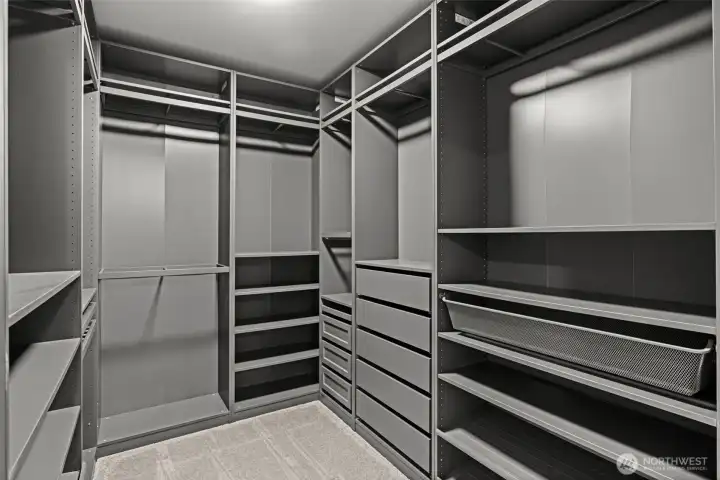 Incredible built-in custom closets in Primary Walk-in Closet