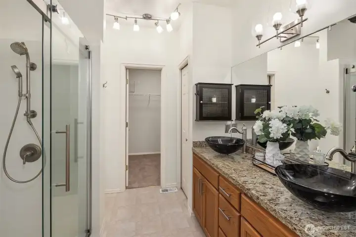 Double vanity with plenty of storage space. New shower surround and updated lighting. Large walk-in closet.
