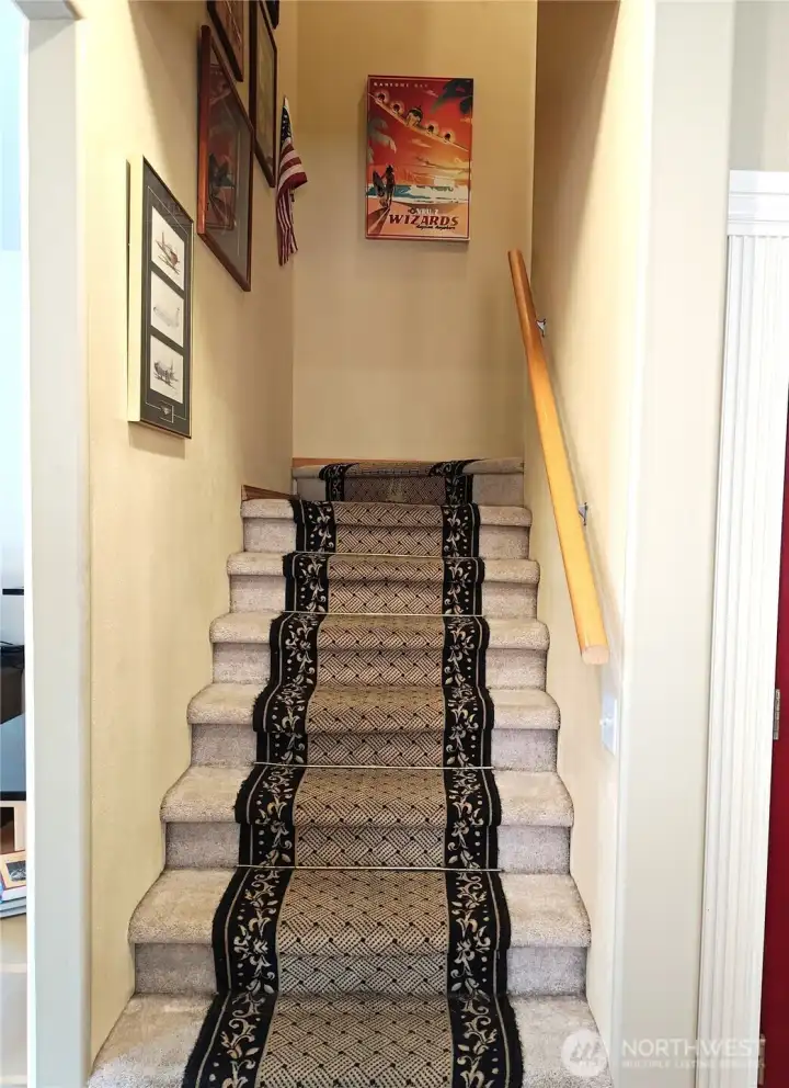 Stairs leading to the bedrooms and media room.