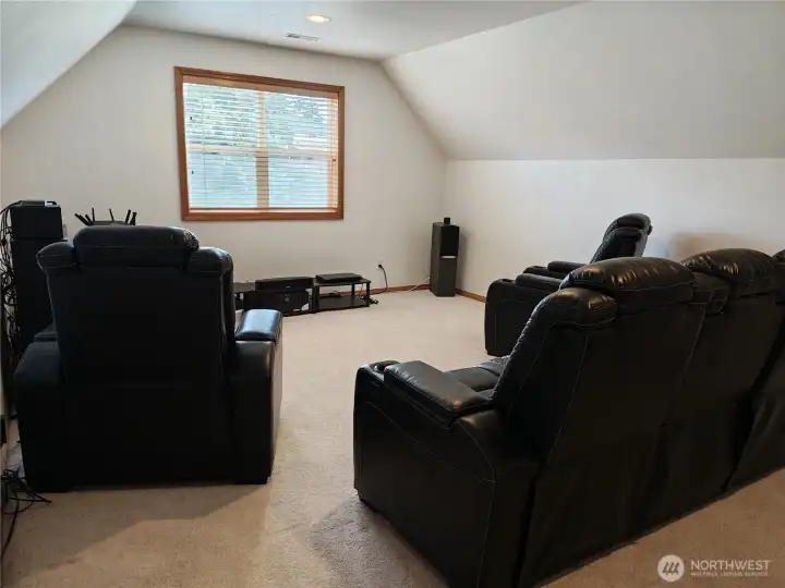 Bonus room now used for a media/screening room. Perfect for your hobby room or home office or just a nice place to relax. Located at the top of the stairs.