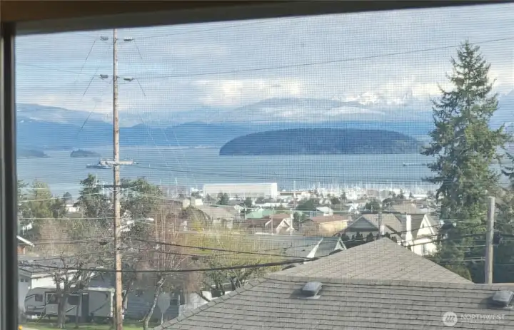 View of the water and mountain ranges over the claw foot tub