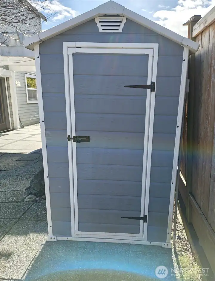 That handy shed. It also has the electronic control for the hot tub