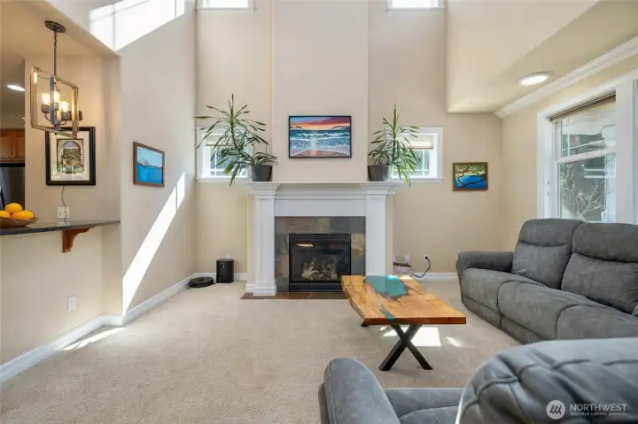 High ceiling with lots of light in this grand living room.