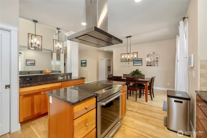 Overhead exhaust and sleek stainless steel appliances.