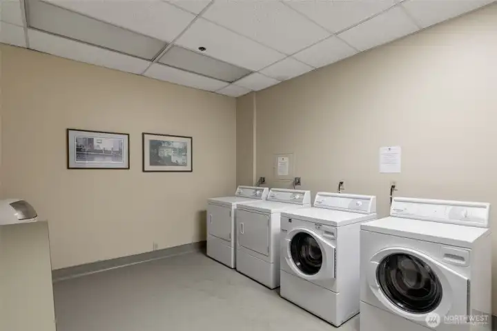 Laundry is just a few steps down the wide hallway from the condo