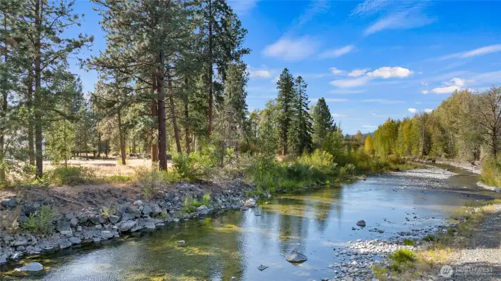 A classic “river runs through it” setting—peaceful, private, and breathtaking.