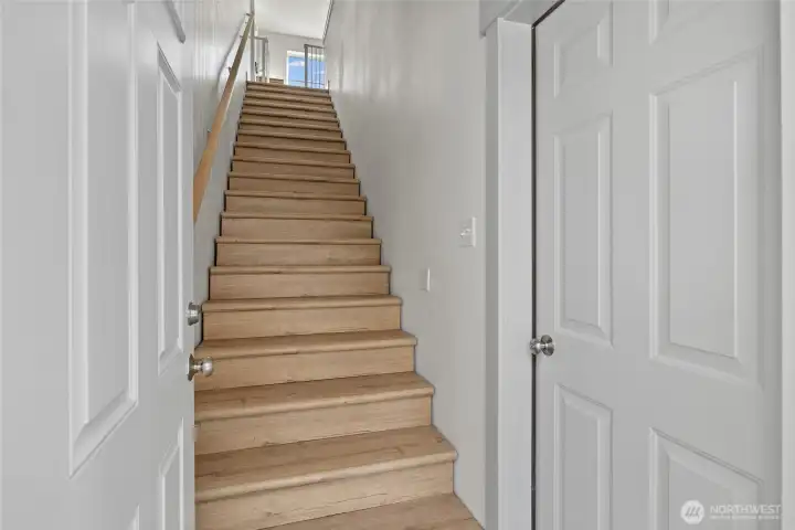 Rear entry offers direct shop access to the right, with stairs up to the living quarters.