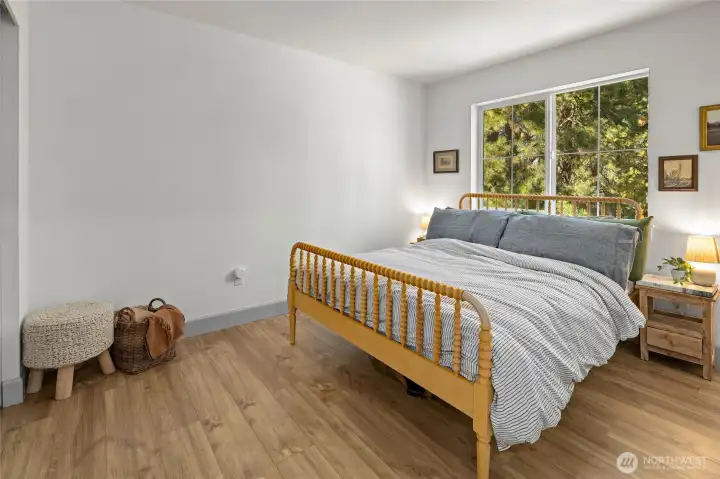 The primary bedroom is located off the kitchen area.