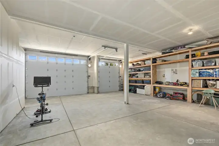 The combination of double and single doors provides a flexible three-bay shop setup.