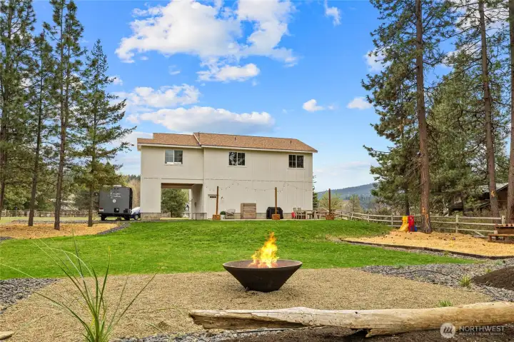 Enjoy evenings around the new cone firepit—an ideal outdoor gathering space with river sounds in the background.