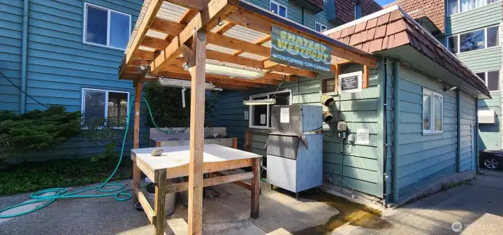 Outdoor clam & fish cleaning area with Ice machine for packaging