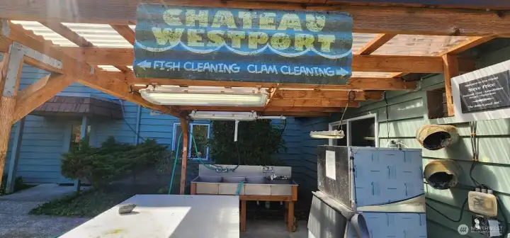 Outdoor clam & fish cleaning area with Ice machine for packaging