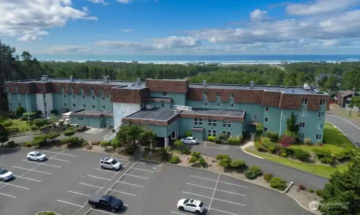 East Side view with additional parking & covered entrance way for loading & unloading.