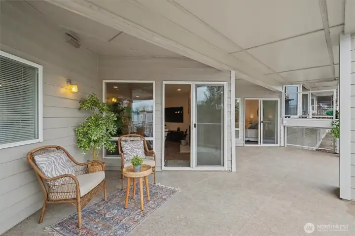 Spacious south-facing covered deck off of living area and primary bedroom