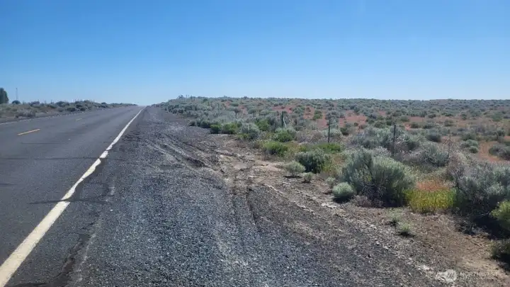 North side of property, from South Frontage Rd NW facing East