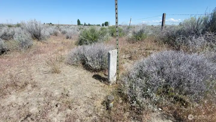 Southeast corner marker, facing North