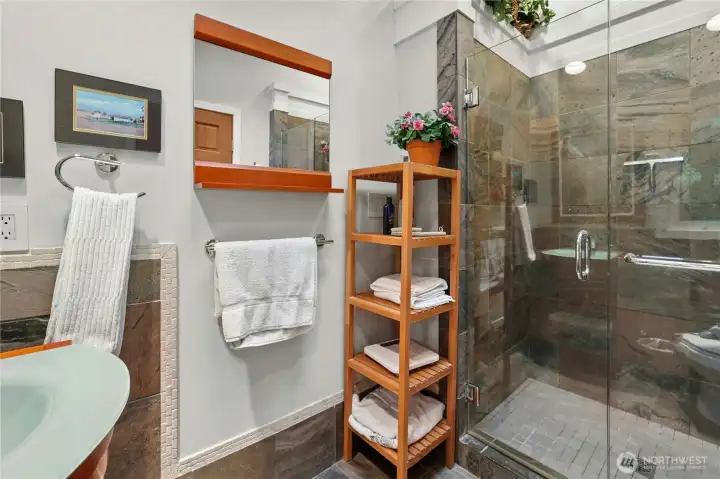 Spa-inspired primary bath with heated slate floors & custom details