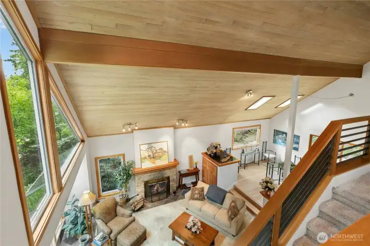 Incredible great room anchored by a striking wood-burning fireplace