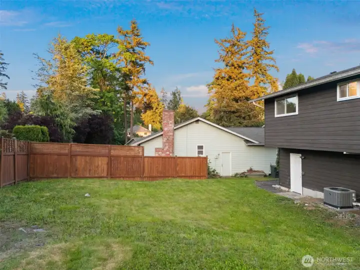 Backyard showing partially fenced yard - loads of potential!