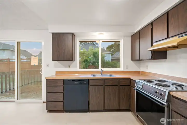 Kitchen with slider to deck - create the deck you want on this home! Larger? Stairs to yard? Lots of options.