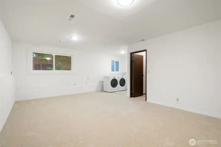 Recreation room with laundry area - all plumbed and ready to add a toilet on this level if desired.