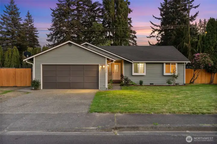 2-car garage, RV parking, and driveway space for versatile parking and everyday ease.